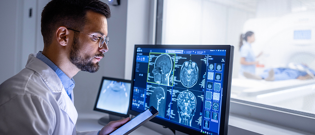 Doctor reviewing MRI scans
